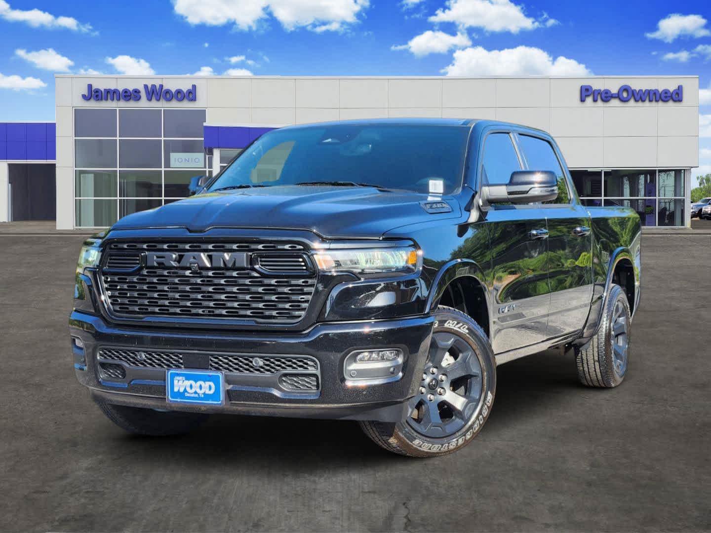 2025 RAM 1500 Lone Star Crew Cab 4x4 5'7" Box in Black — front three-quarter view