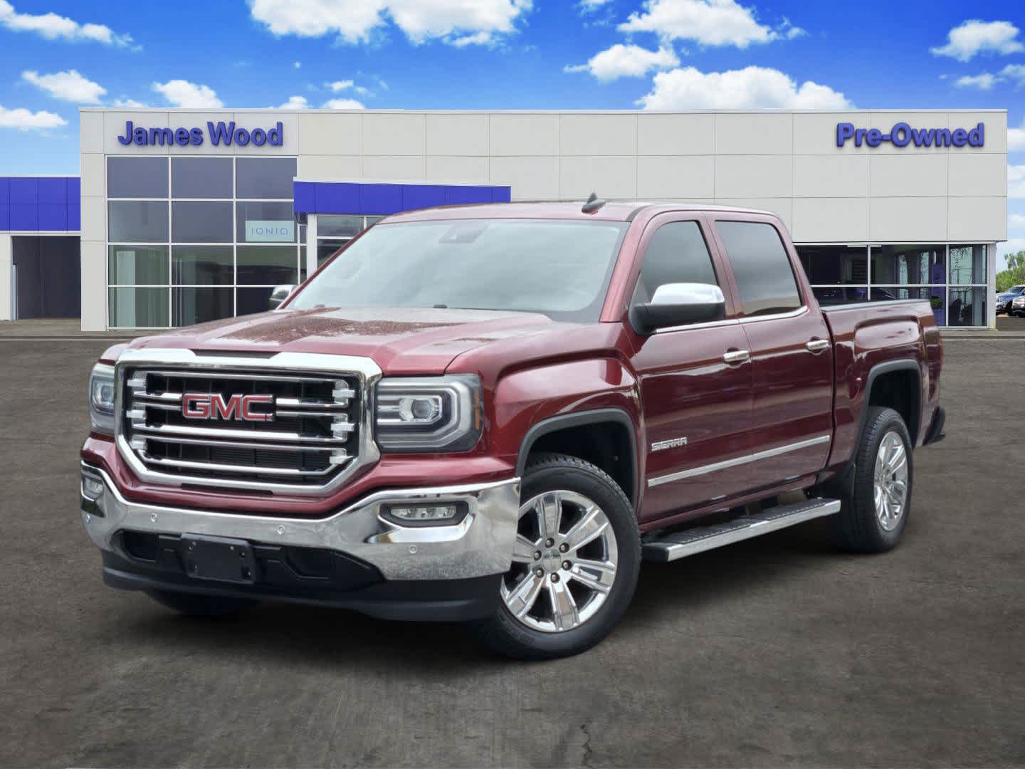2016 GMC Sierra 1500 SLT in Crimson Red Tintcoat — front three-quarter view