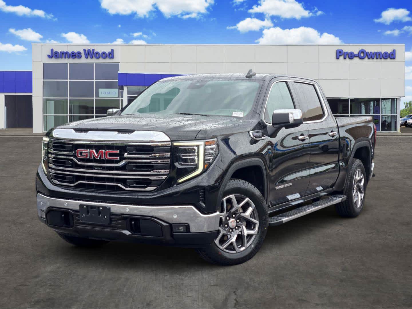 2024 GMC Sierra 1500 SLT in Onyx Black — front three-quarter view
