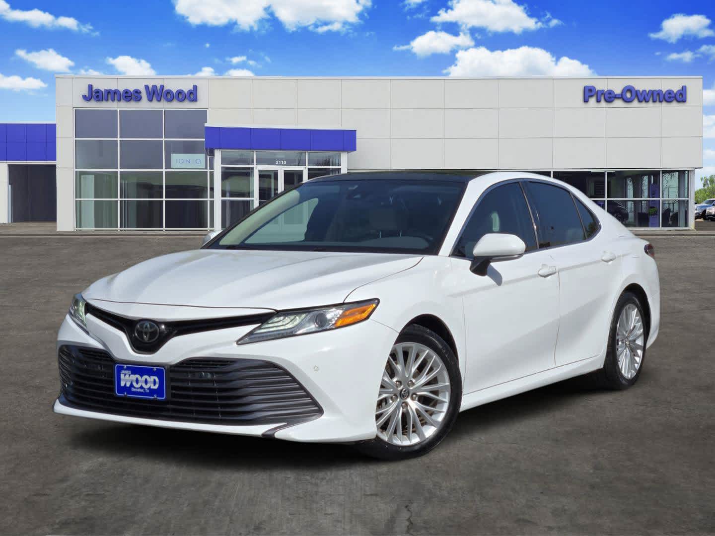 2018 Toyota Camry XLE in White — front three-quarter view