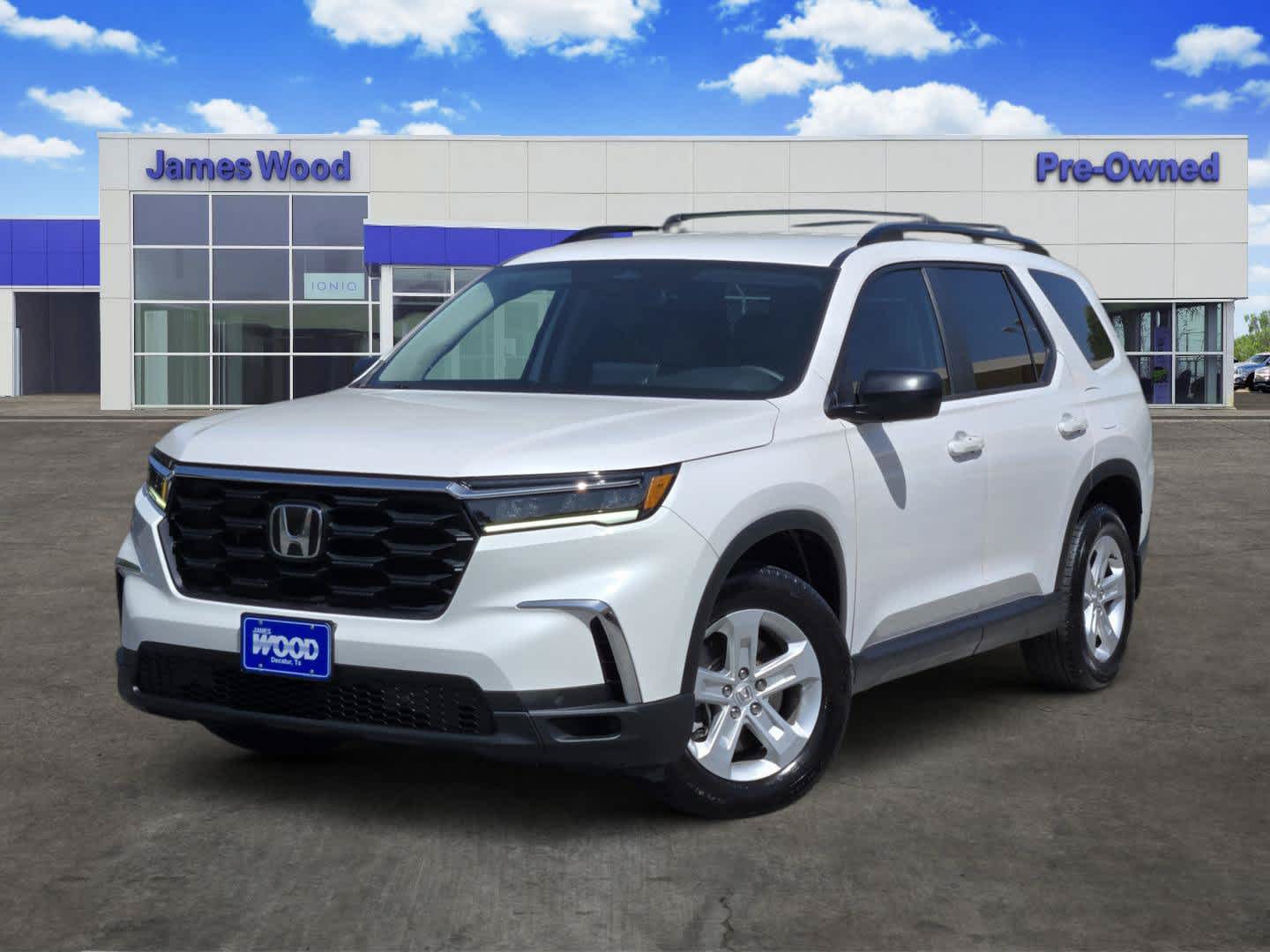 2023 Honda Pilot AWD LX in White — front three-quarter view