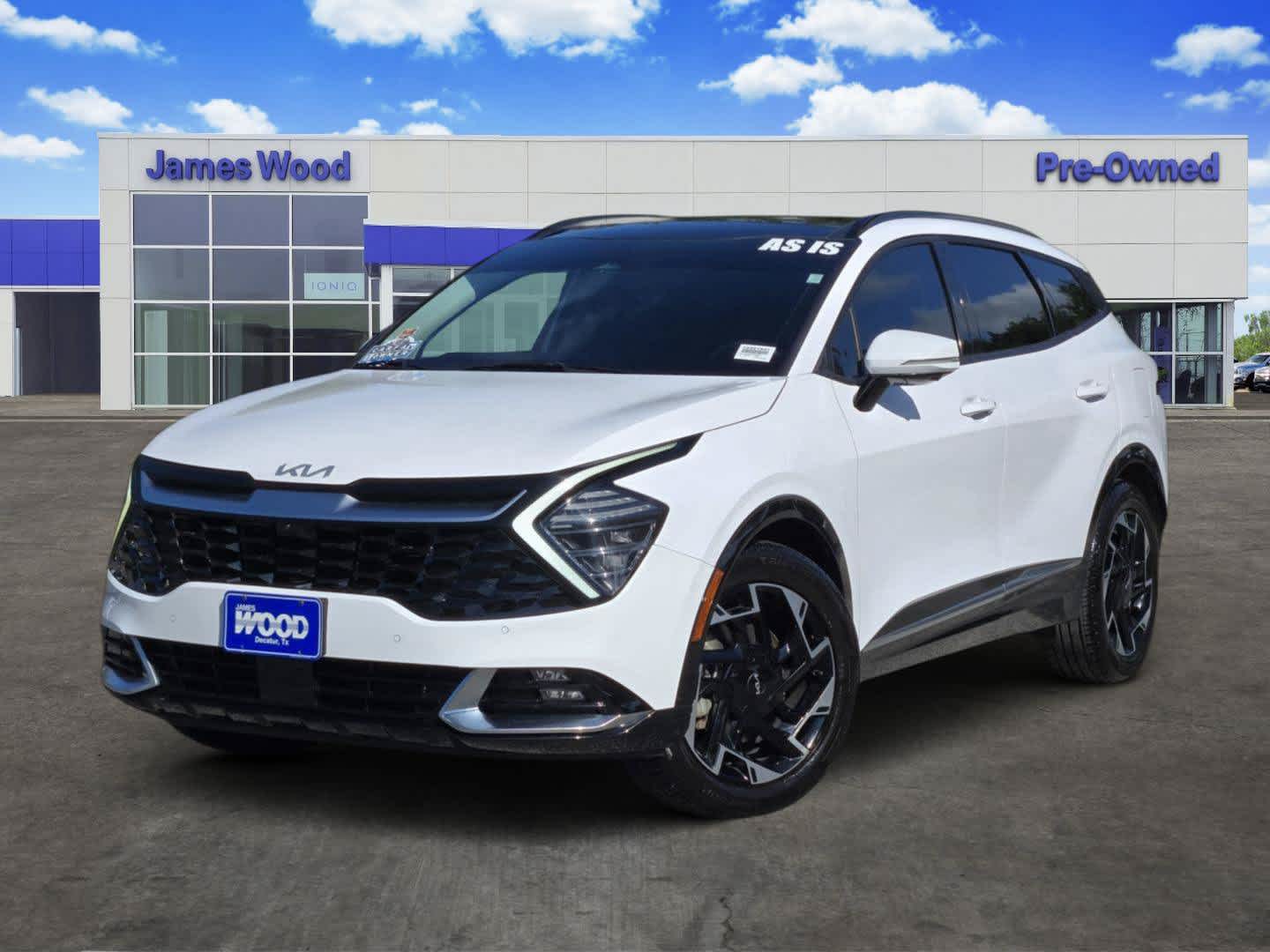 2023 Kia Sportage SX-Prestige in White — front three-quarter view